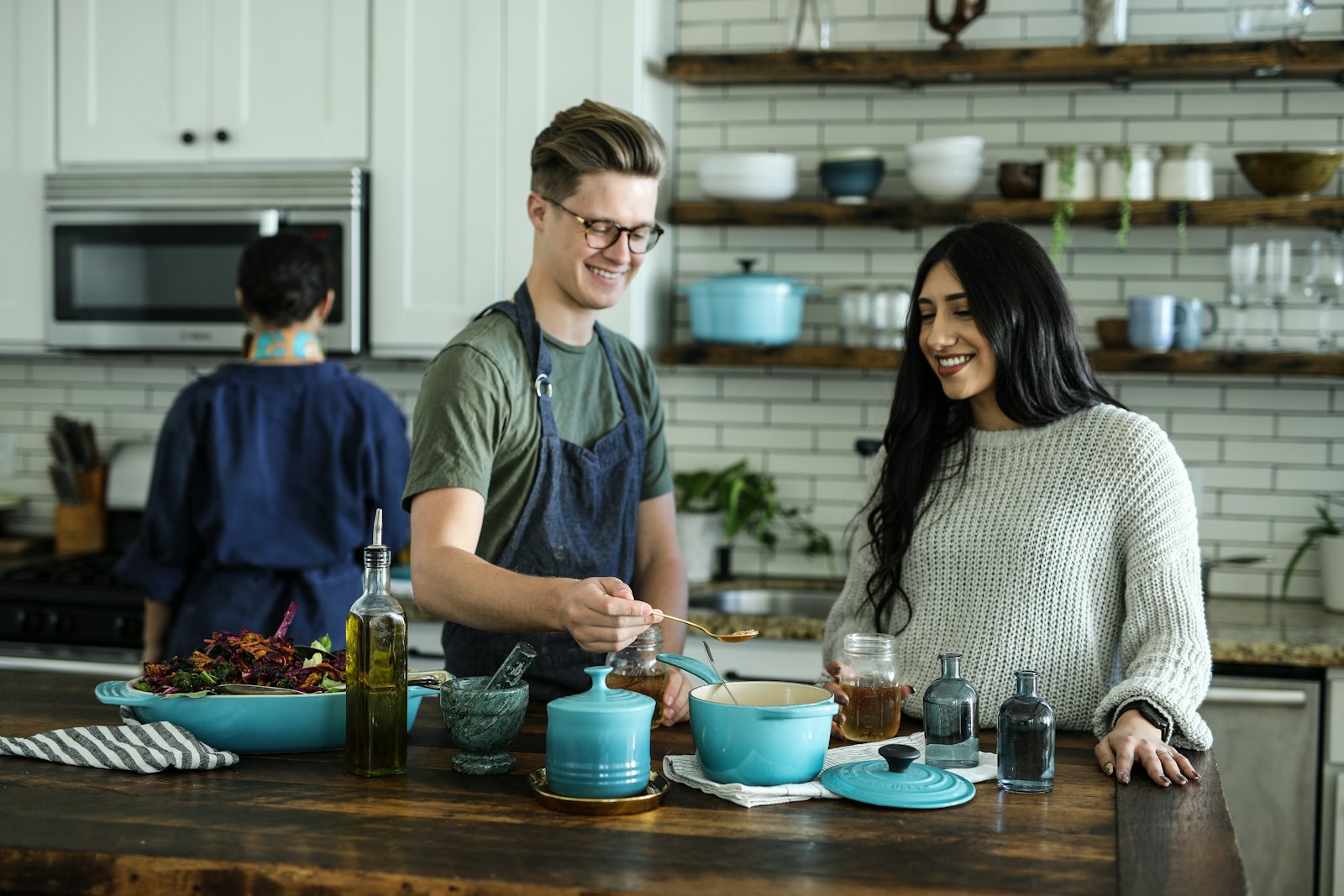 Two people preparing a fresh meal together in a home kitchen