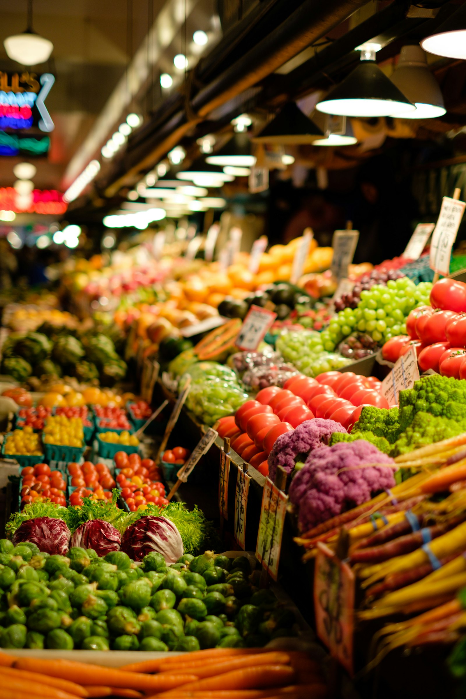 A market stall stacked with fresh fruit and vegetables